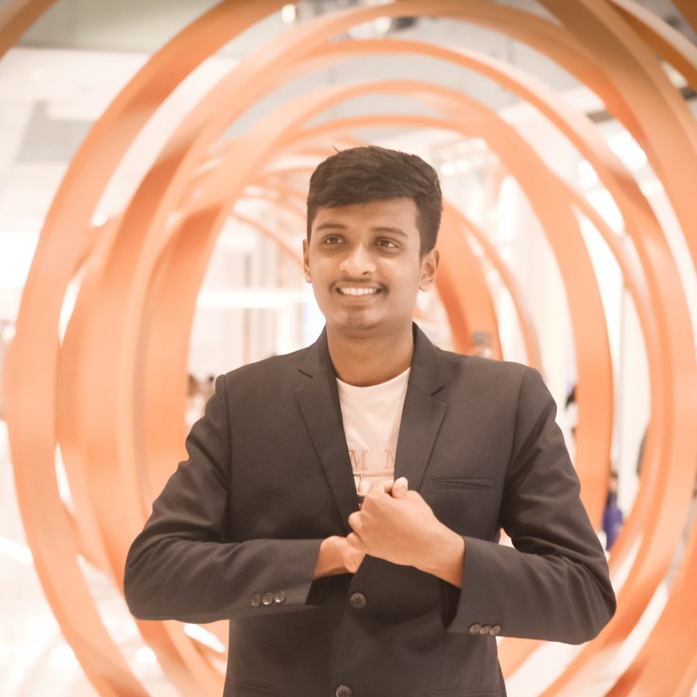portrait-businessman-standing-against-building